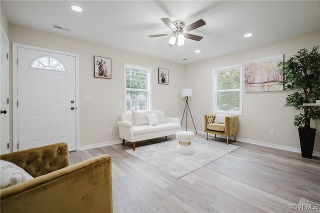 interior space with light wood finished floors, baseboards, and recessed lighting