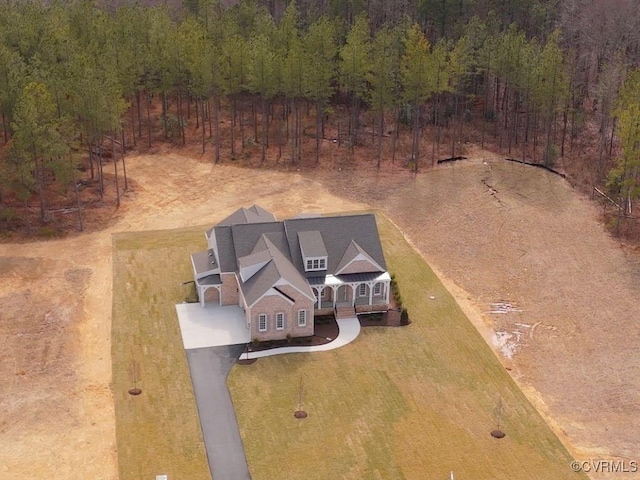 drone / aerial view featuring a view of trees