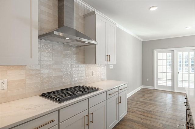 8383 Mount Eagle Rd, Hanover, VA 23005 - kitchen featuring wall chimney exhaust hood, stainless steel gas cooktop, baseboards, ornamental molding, and wood finished floors