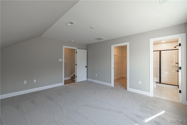 8383 Mount Eagle Rd, Hanover, VA 23005 - unfurnished bedroom with a spacious closet, light carpet, baseboards, lofted ceiling, and a closet