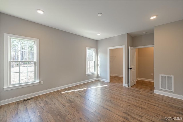 8383 Mount Eagle Rd, Hanover, VA 23005 - spare room with healthy amount of natural light, baseboards, wood finished floors, and recessed lighting