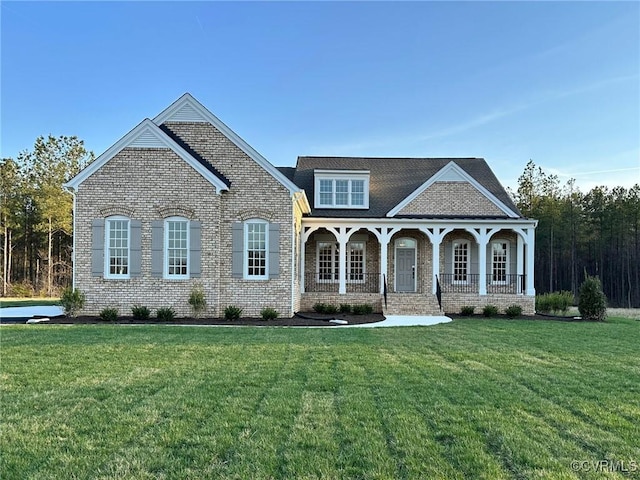 8383 Mount Eagle Rd, Hanover, VA 23005 - view of front facade featuring brick siding, a front lawn, and a porch