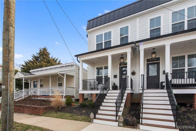 view of front of house with a porch and stairway