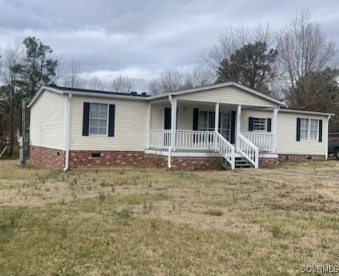 view of front of home with crawl space, covered porch, and a front lawn