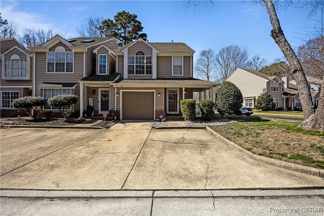 view of front of house with a garage and concrete driveway