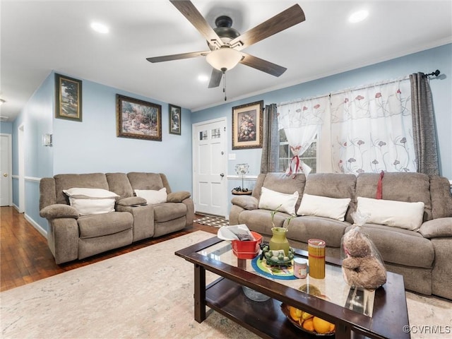 living area with ornamental molding, recessed lighting, ceiling fan, and wood finished floors