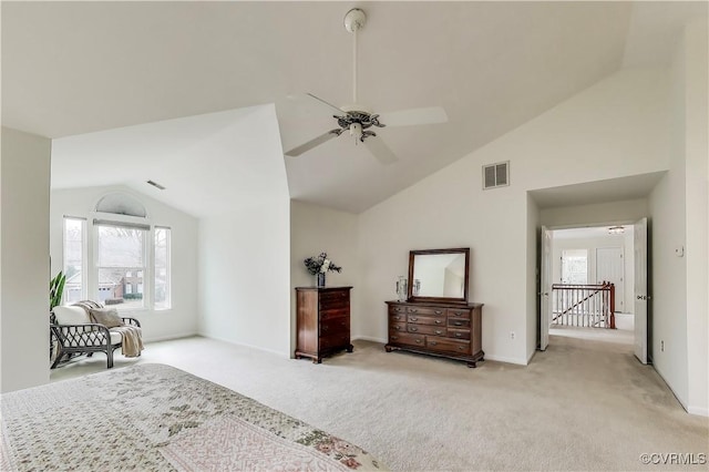 bedroom featuring light colored carpet, visible vents, and multiple windows