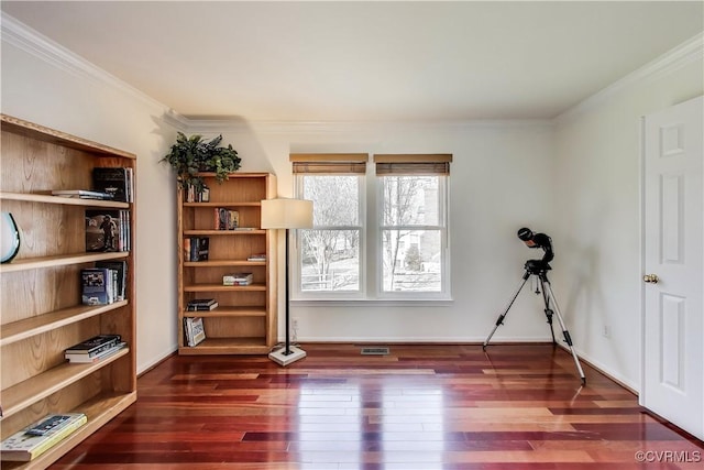 interior space featuring baseboards, visible vents, ornamental molding, and dark wood-type flooring