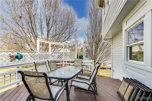 wooden deck featuring outdoor dining space