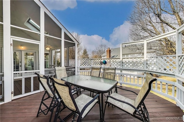 wooden deck featuring french doors and outdoor dining area