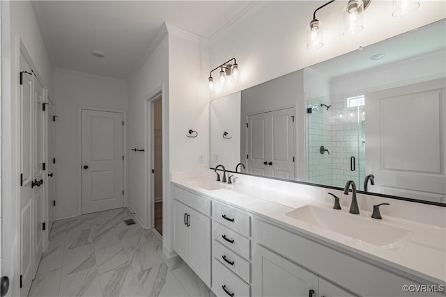 bathroom featuring crown molding, a sink, and a shower stall