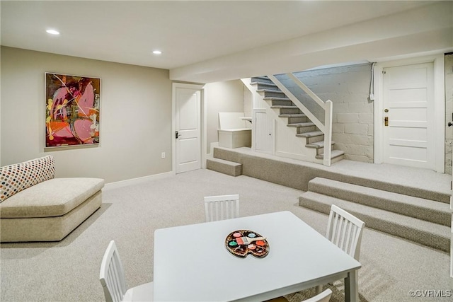 carpeted living area featuring recessed lighting, stairway, and baseboards