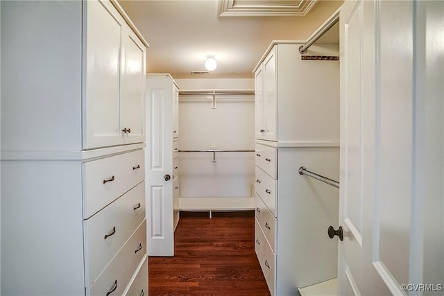 walk in closet featuring visible vents and dark wood-style flooring