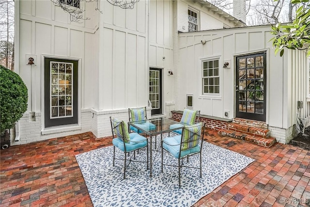 view of patio / terrace with outdoor dining space and entry steps