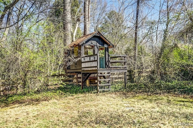 view of outbuilding with a view of trees