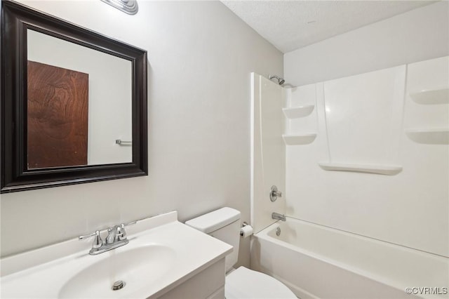 full bath featuring a textured ceiling, bathtub / shower combination, vanity, and toilet