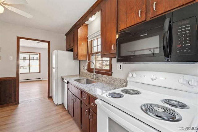 kitchen with white electric range, light wood-style flooring, a sink, black microwave, and dishwasher