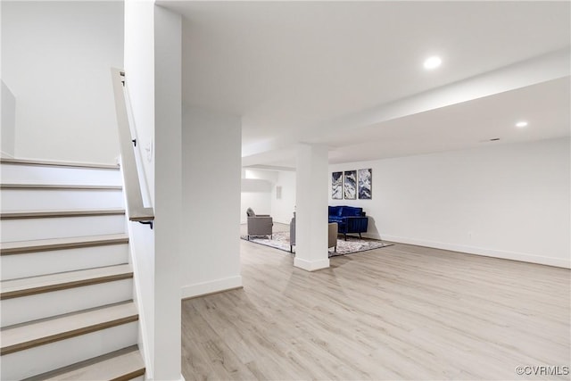 interior space with recessed lighting, wood finished floors, and baseboards