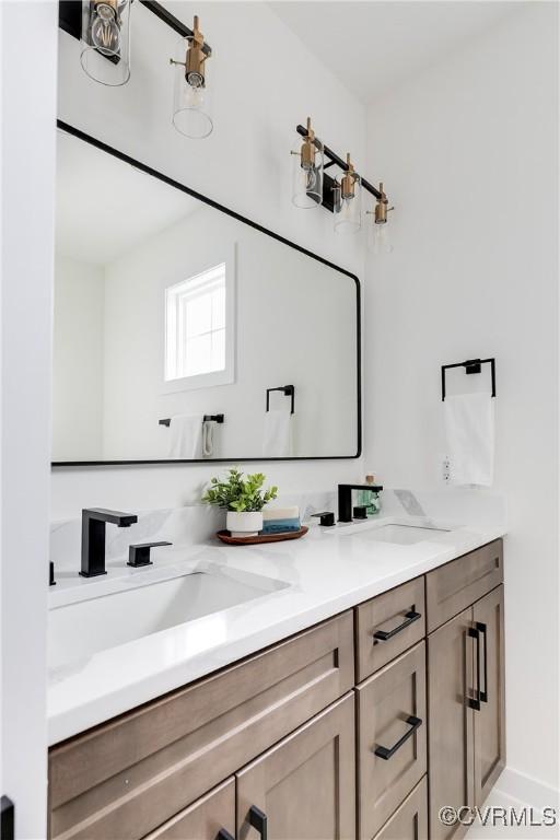 bathroom with double vanity and a sink