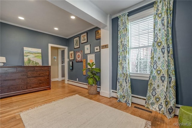 interior space featuring recessed lighting, visible vents, ornamental molding, wood finished floors, and baseboards