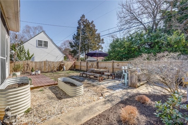 view of yard with a fenced backyard and a patio