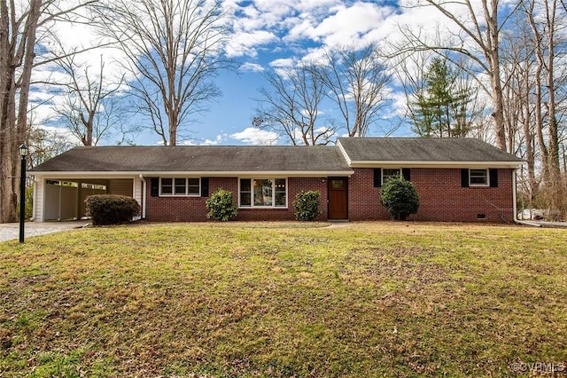 single story home featuring brick siding, an attached carport, a front yard, crawl space, and driveway