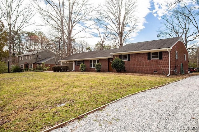 view of front facade featuring a front yard, a garage, brick siding, and crawl space