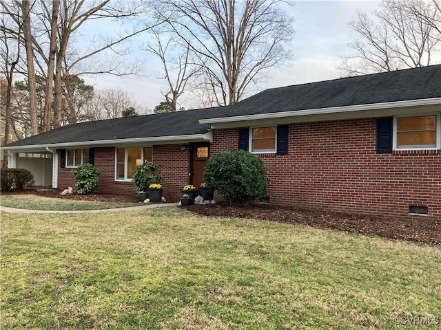 single story home with brick siding, an attached garage, and a front lawn