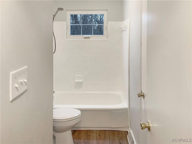 605 Conley Rd, Richmond, VA 23227 - full bath featuring shower / bath combination, wood finished floors, and toilet