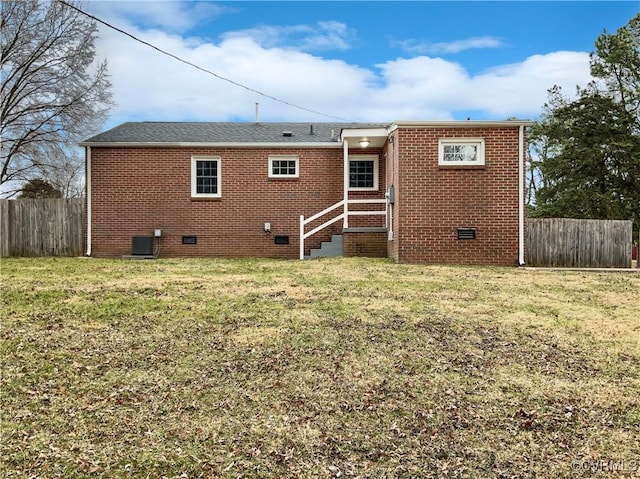 605 Conley Rd, Richmond, VA 23227 - back of house with brick siding, crawl space, and fence