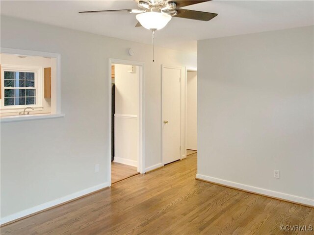 605 Conley Rd, Richmond, VA 23227 - spare room with light wood-style flooring, baseboards, ceiling fan, and a sink