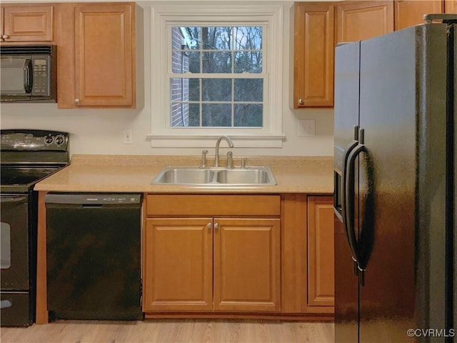 605 Conley Rd, Richmond, VA 23227 - kitchen featuring light countertops, a sink, and black appliances