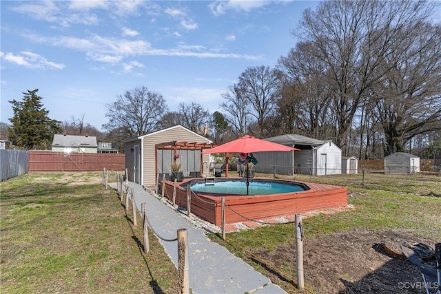 view of yard with an outbuilding and a fenced backyard