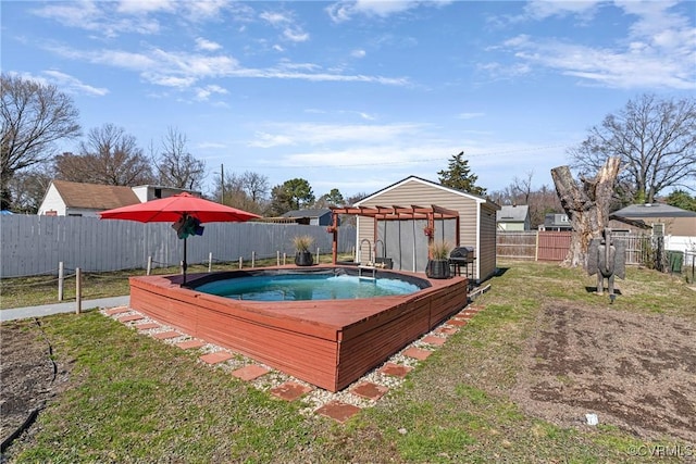 view of pool featuring a fenced backyard, grilling area, a pergola, and a yard