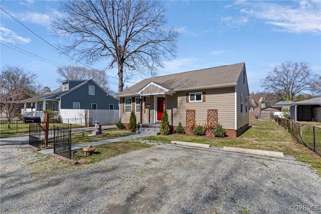 bungalow-style house featuring fence