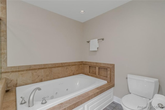 full bath with baseboards, a jetted tub, toilet, and tile patterned floors