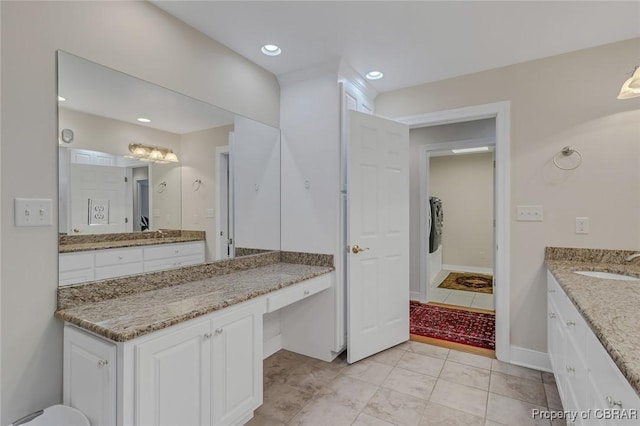 full bathroom featuring recessed lighting, baseboards, and vanity