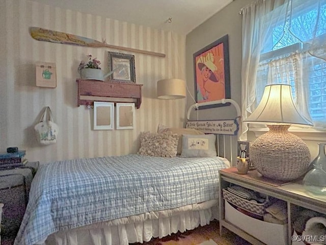 bedroom with wallpapered walls