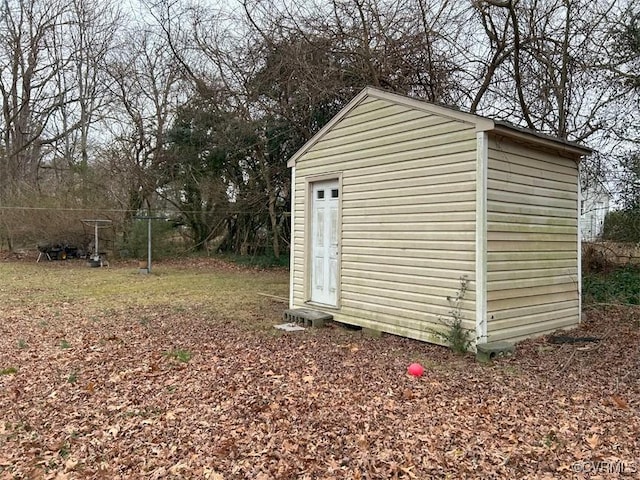 view of shed with fence