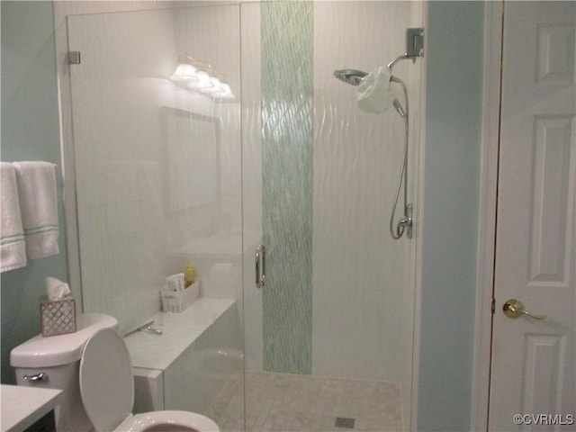 full bathroom featuring toilet and a stall shower