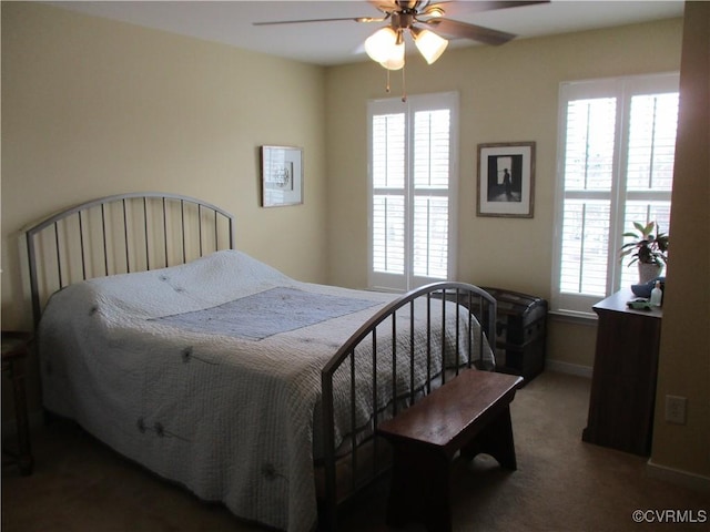 bedroom featuring ceiling fan, carpet floors, and baseboards