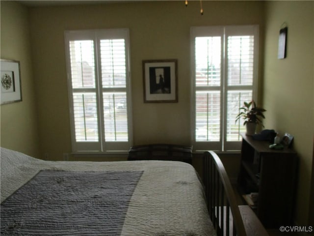 bedroom with multiple windows