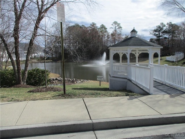 exterior space featuring a water view and a gazebo