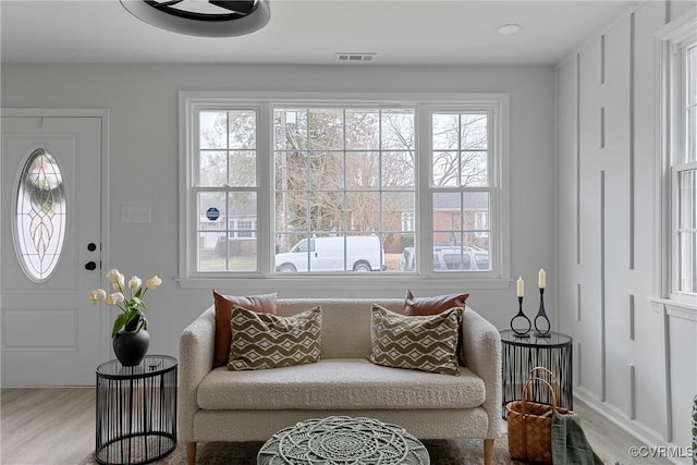 interior space featuring visible vents and wood finished floors