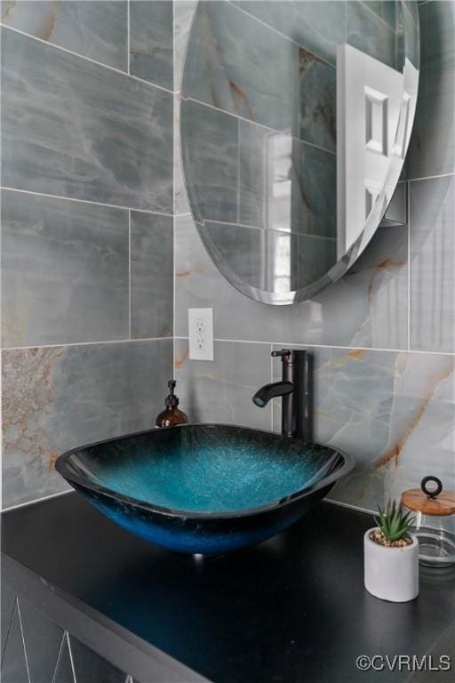 interior details with tasteful backsplash and a sink