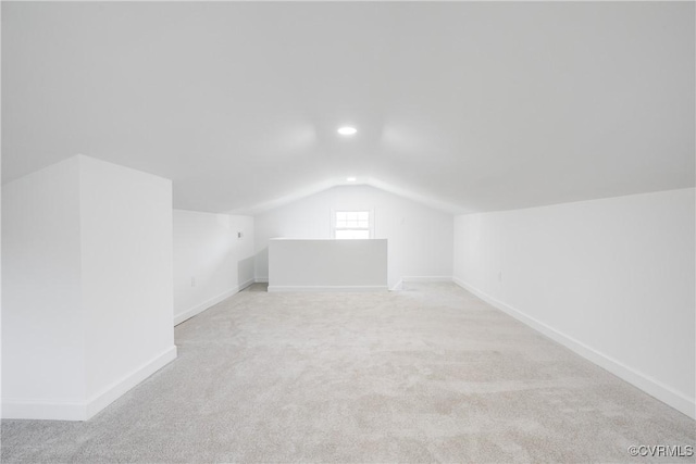 bonus room featuring vaulted ceiling, recessed lighting, light colored carpet, and baseboards