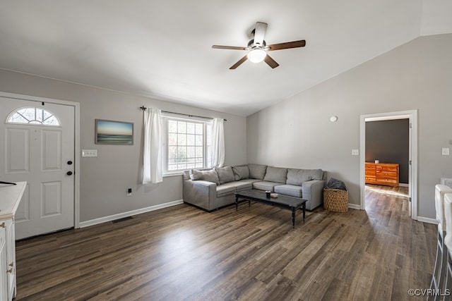 living area with lofted ceiling, visible vents, and dark wood-style flooring