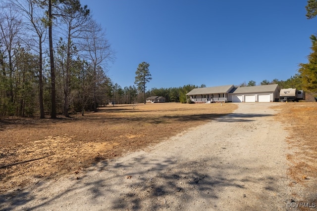 view of road with driveway