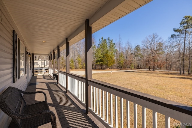 wooden terrace with a porch