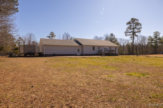 back of house with a yard and a wooden deck